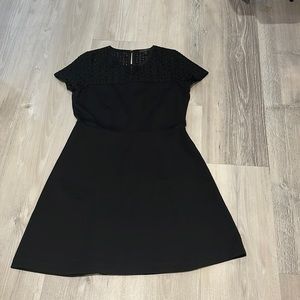Black aline dress with eyelet detailing at top